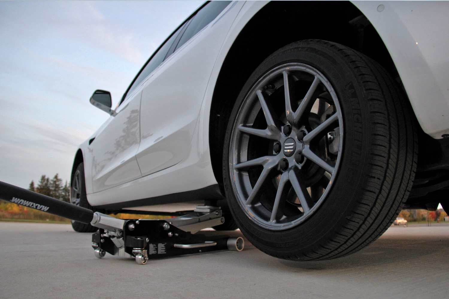 Model 3 lifted using a jack 5